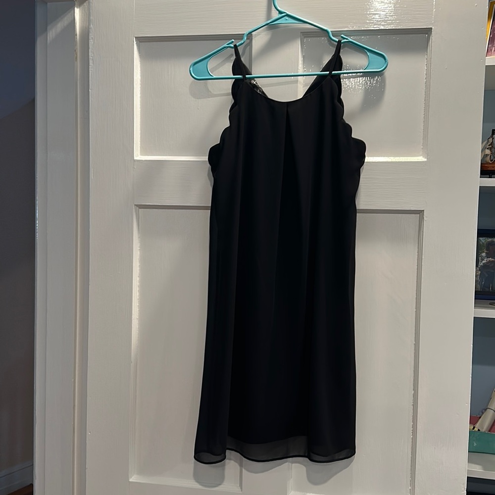 Scalloped black mini dress